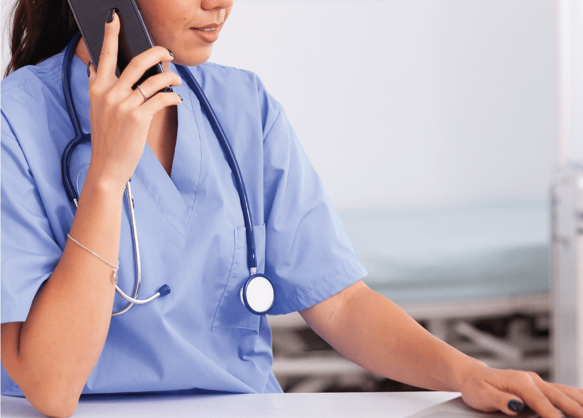 Female-Nurse-On-Phone-cropped-min Female-Nurse-On-Phone-cropped-min