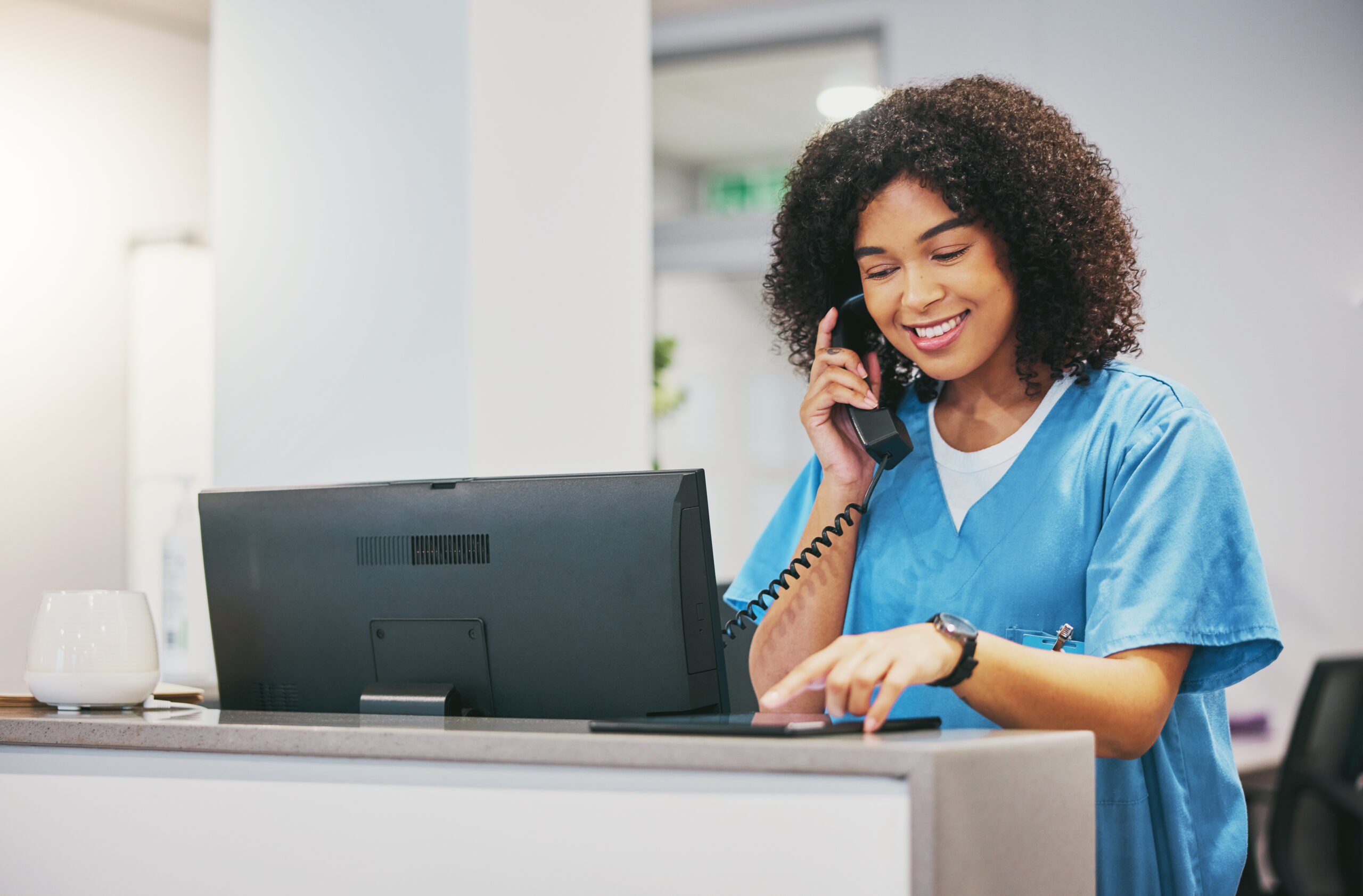 Nurse, phone call and tablet of black woman at hospital with a smile. Clinic doctor, healthcare wor.