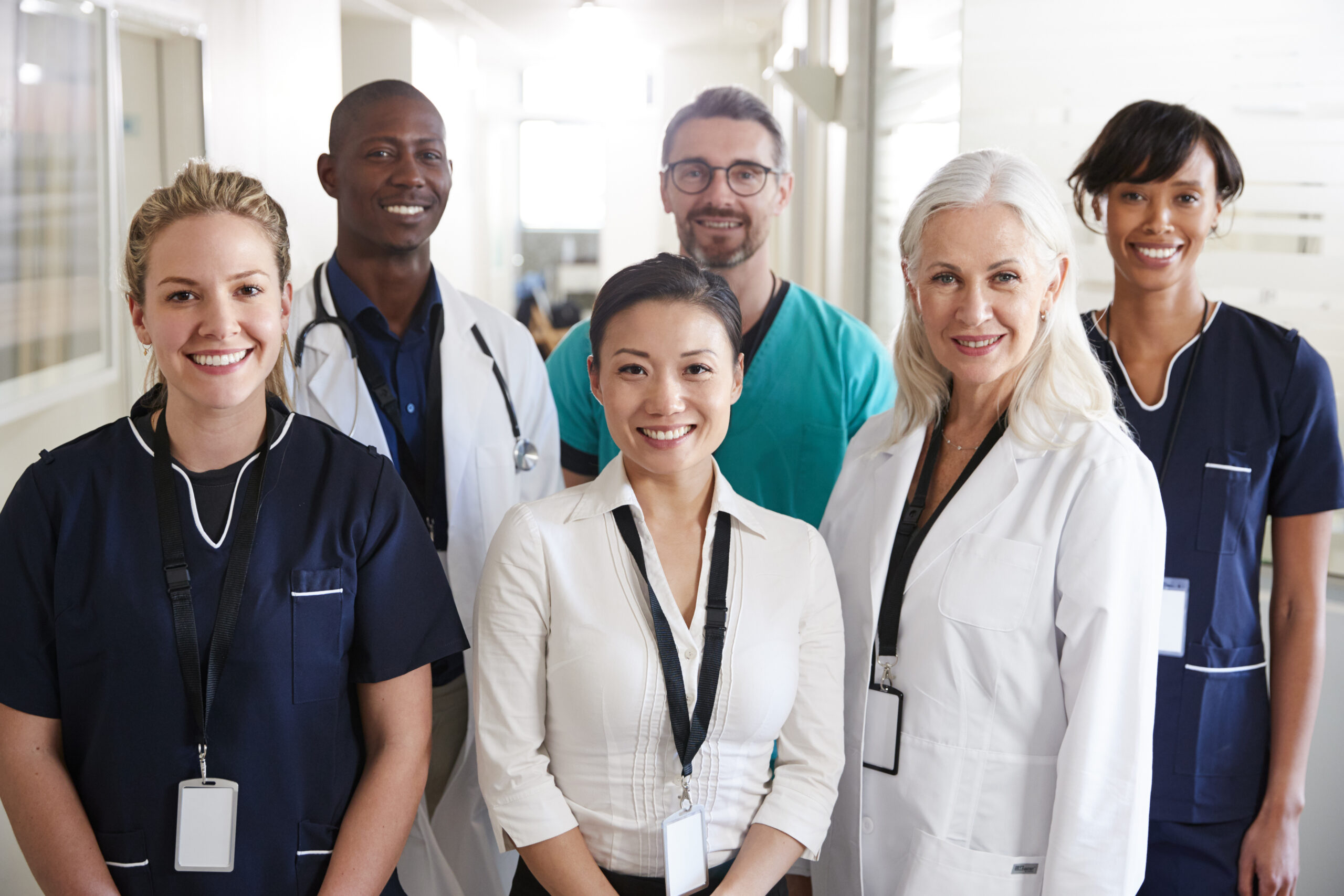 Portrait Of Medical Team Standing In Hospital Corridor Portrait Of Medical Team Standing In Hospital Corridor